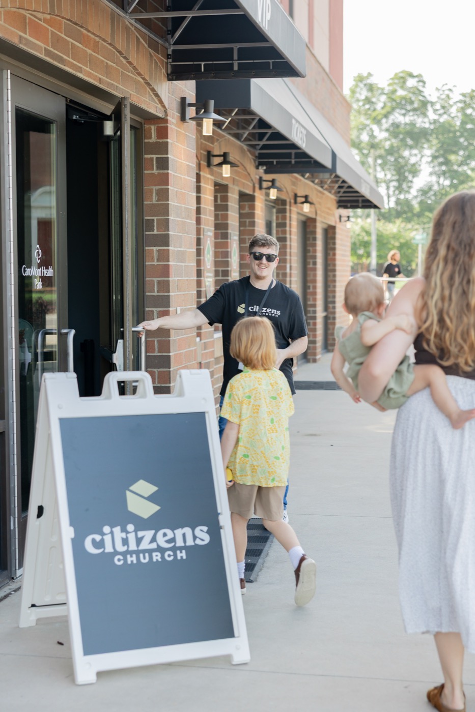 A family being welcomed at Citizens Church